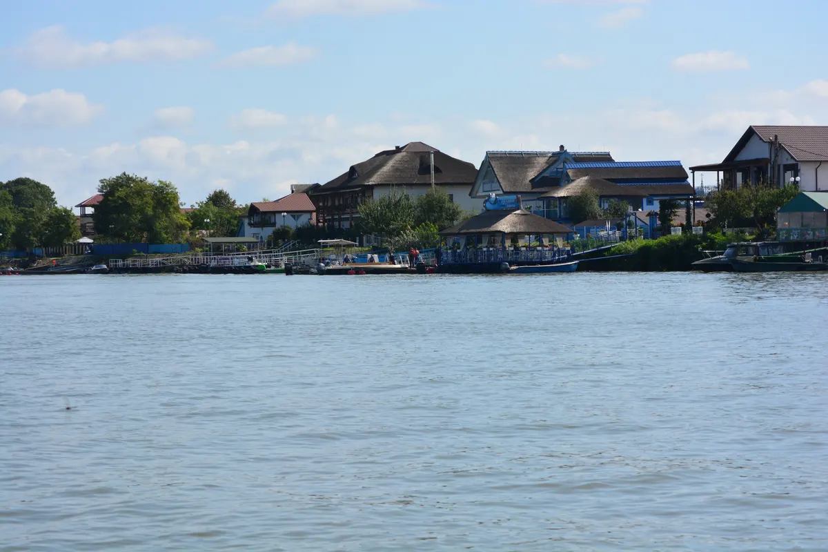 Mila 23 village seen from the water